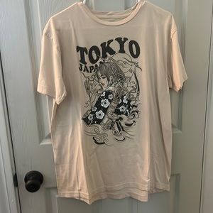 Tan t-shirt from LCM international. Size Large.